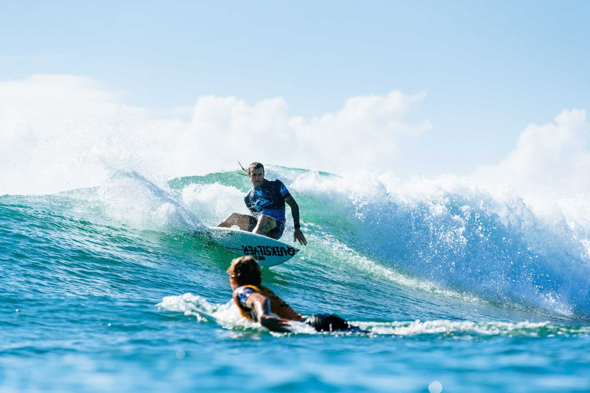 Quiksilver Pro Gold Coast wildcard Mikey Wright (AUS) surfs past 2x WSL Champion and current World No. 1, John John Florence (HAW), in the opening elimination heat of Round 1. Caption: © WSL / Sloane