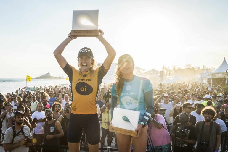 Caption: Six-time WSL Champion Stephanie Gilmore (AUS) and Lakey Peterson (USA) celebrate their success at the Oi Rio Pro. Credit: © WSL / Poullenot