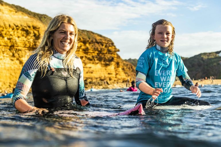 Stephanie Gilmore and Rising Tides participant taking in the water at Bells Beach
