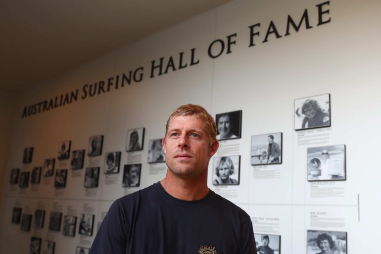 Mick Fanning standing in front of the Surfing Hall of Fame