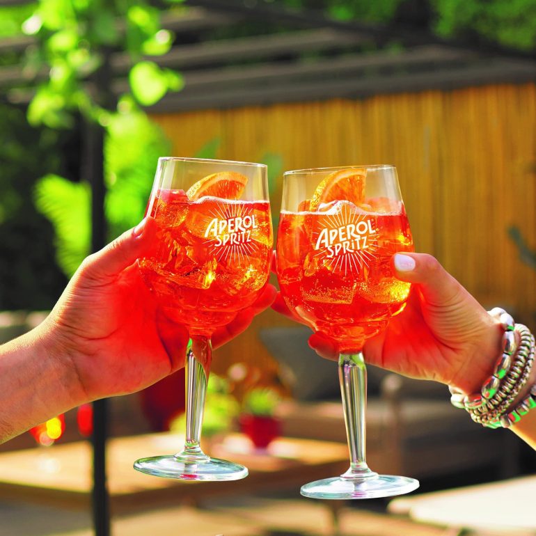 Aperol is shouting 100,000 spritzes to celebrate coming together